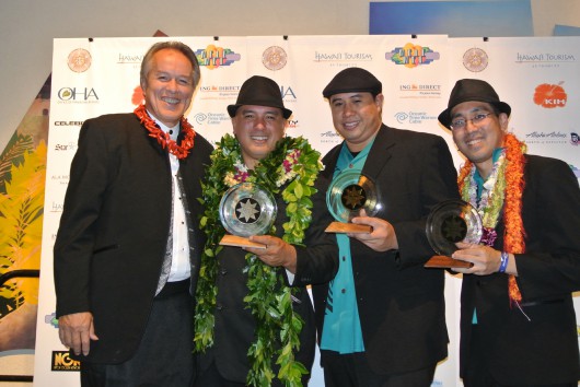 Max Sword, vice president of industry affairs, Outrigger Enterprises Group, with the group Waipuna, Matt Sproat, Kale Hannahs and David Kamakahi (photo courtesy of Mona K. Wood-Sword)