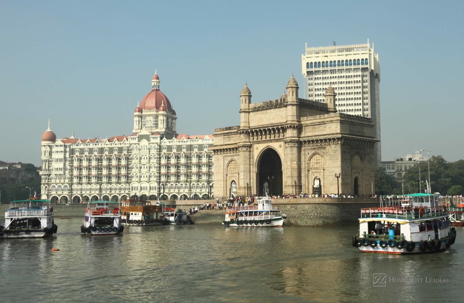 Famous landmarks of Bombay - Gate of India and Taj Mahal Hotel - seen from the sea, India