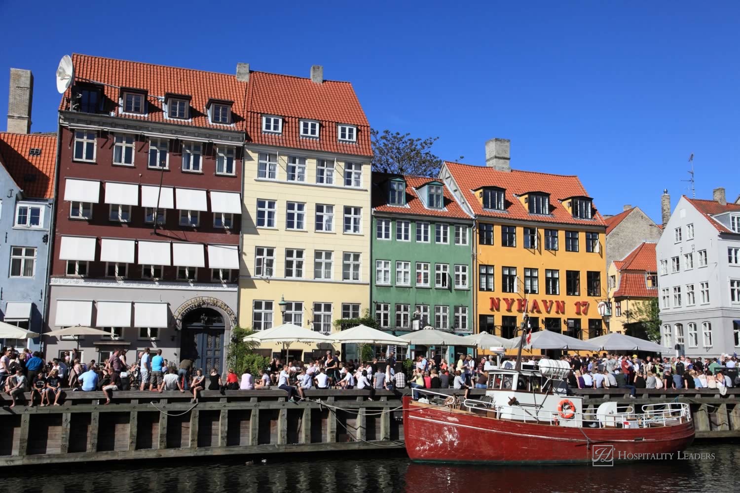 COPENHAGEN, DENMARK - JUNE 5: Crowds gather at Nyhavn, the landmark medieval port and bar district, on June 5, 2010 to celebrate the anniversary of Constitution Day in Copenhagen, Denmark