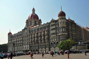 Hospitality News: Mumbai, India - Nov 5: A group of people walk in front of Taj Mahal Palace & Tower hotel in Mumbai on November 5, 2009. On 26 November 2008, the hotel was attacked by terrorists