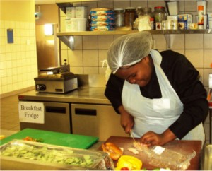 Kate prepping in the kitchen