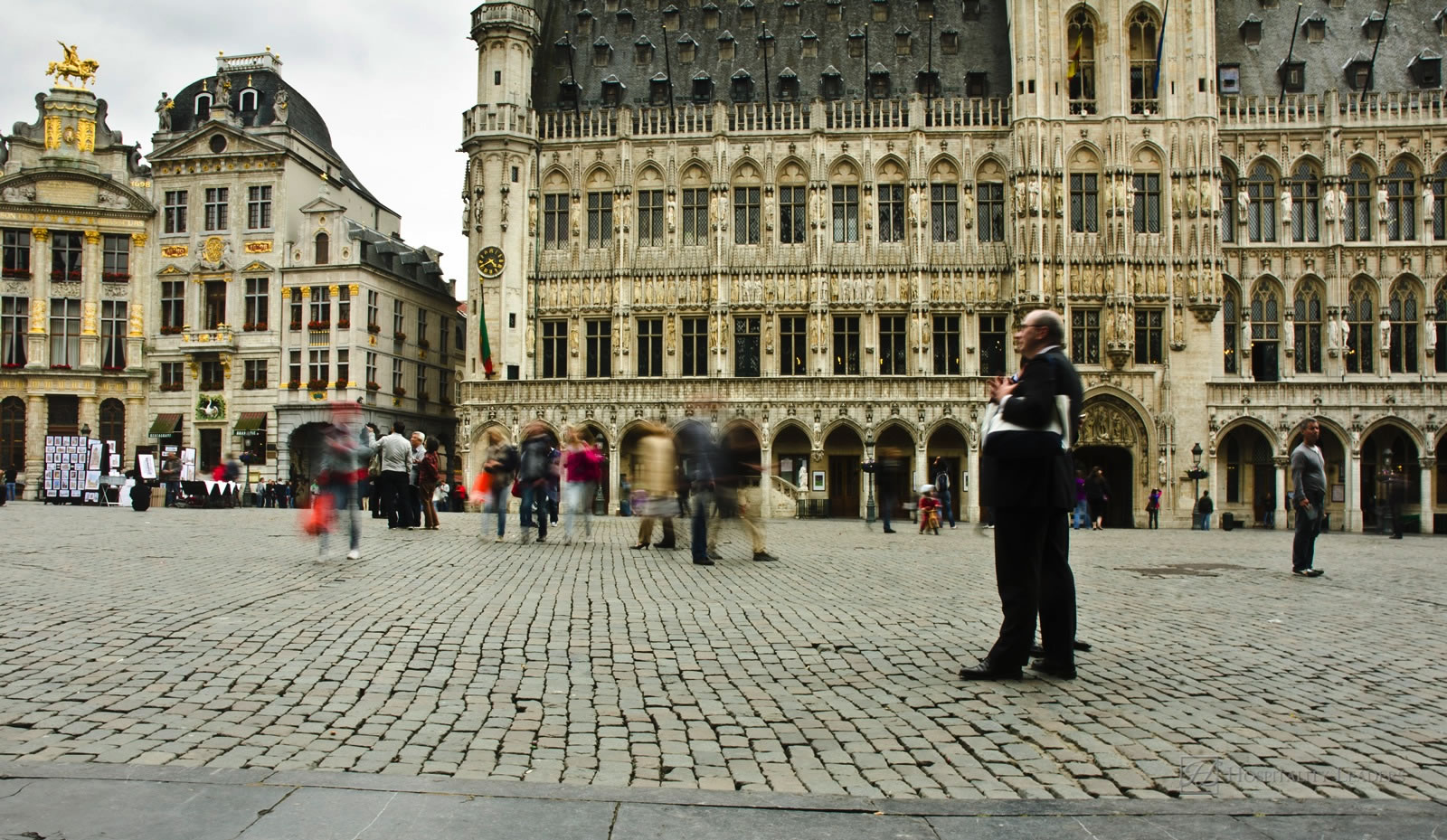 Brussels, Belgium - June 13: a man stands in the Grand Place on June 13, 2012 in Brussels, Belgium. The Grand Place is the most famous location in Brussels and is a UNESCO World Heritage Site