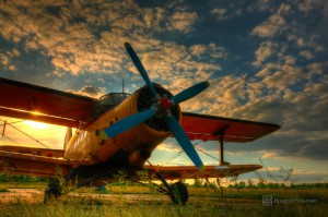 Hospitality News: HDR foto of an old airplane on green grass and sunset background