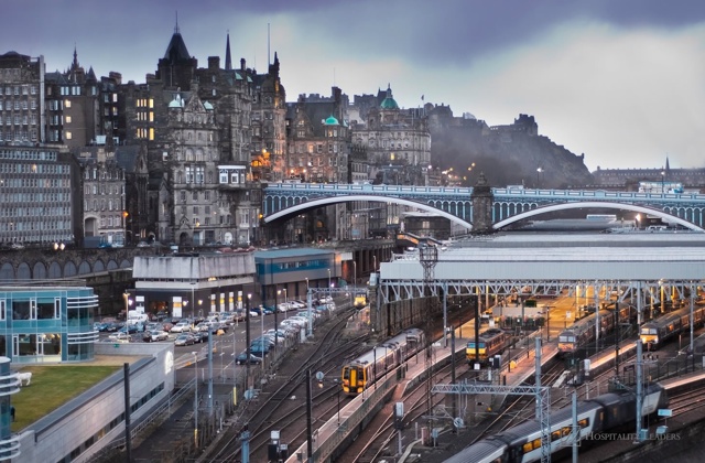 Central Edinburgh, Scotland - landscape view of Waverley Station, North Bridge and Edinburgh Castle