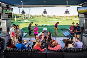 Guests playing Topgolf in Naperville, IL - Photo: Topgolf